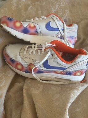 Nike White Sneakers with Purple Swoosh and Orange Lining